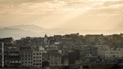 Morning in a Morocco city  Fez. Mountains in the background © Rik