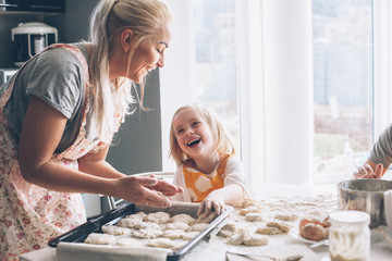 Mom cooking with daughter on the kitchen