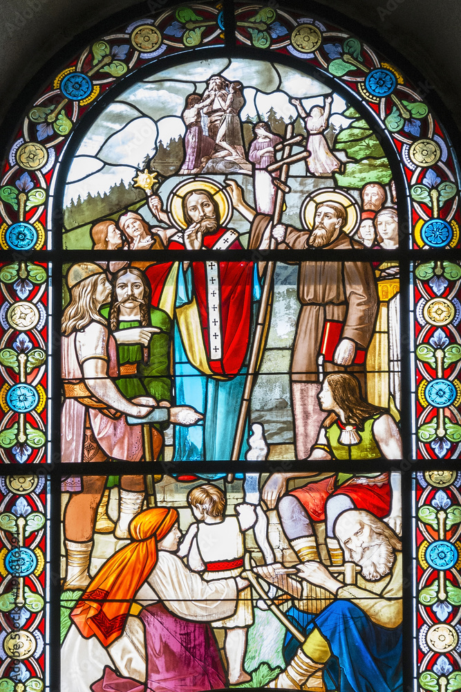 Stained-glass windows with religious themes.