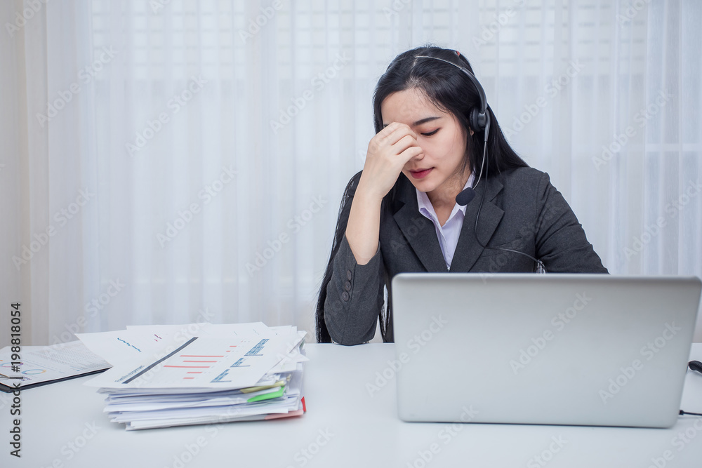 Call center operator. Feeling stress from work in the office Call center operator. Feeling stress from work in the office