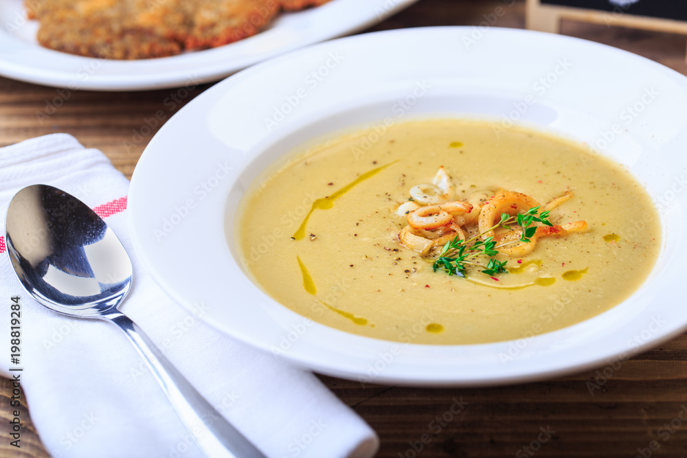 vegetable soup with sea products and herbs lunch time