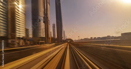 Dubai elevated Rail Metro System, running alongside the Sheikh Zayed Rd Time Lapse. High Speed Metro Train in Dubai.
