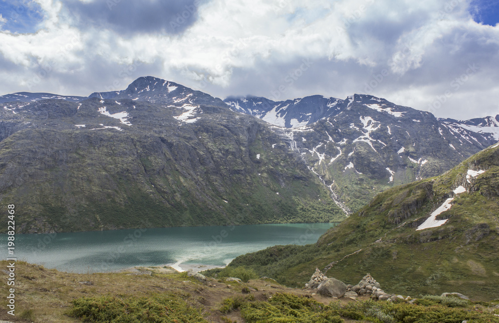 Panoramic view of Norwegian fjords under gray clouds