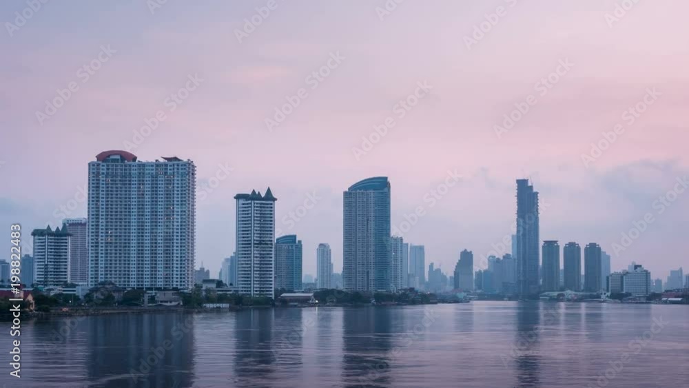 Timelapse - Bangkok city at sunrise with lighted at The downtown area with the Chao Phraya River. Timelapse - Bangkok city at sunrise with lighted at The downtown area with the Chao Phraya River.