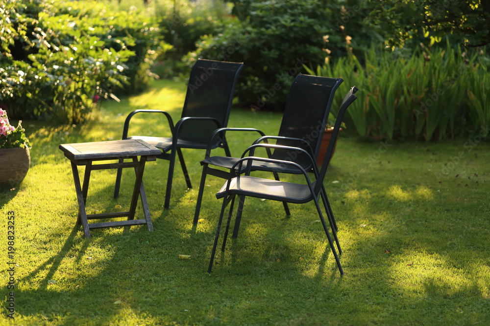 Garden idyll with chairs and table Garden idyll with chairs and table