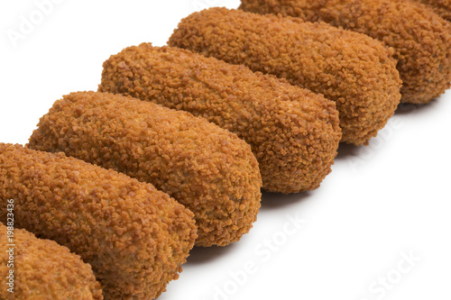 Row of deep fried Dutch kroketten photo