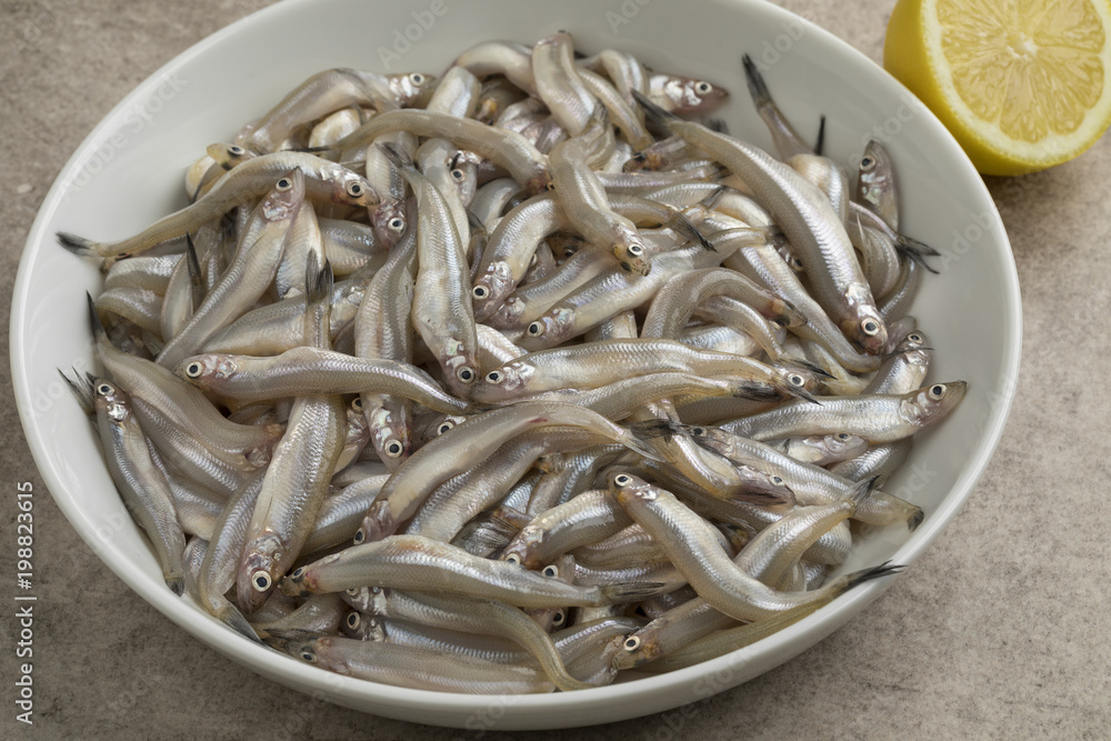 Dish with fresh smelt fishes