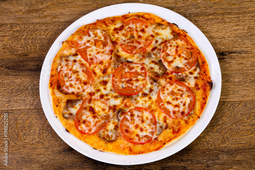 Pizza with beef and tomato