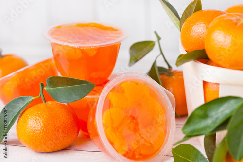 Plastic containers with mandarine tengerine jelly photo