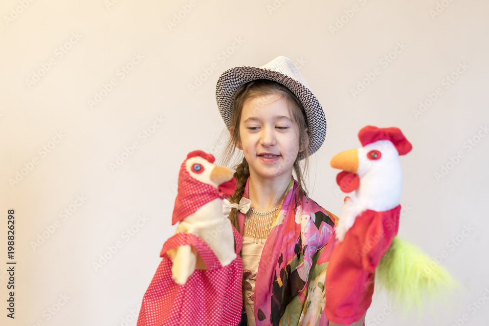 Happy child, creative fun concept - girl playing in the theater Happy child, creative fun concept - girl playing in the theater