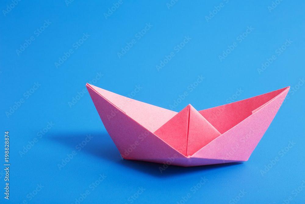paper boat on blue paper background paper boat on blue paper background