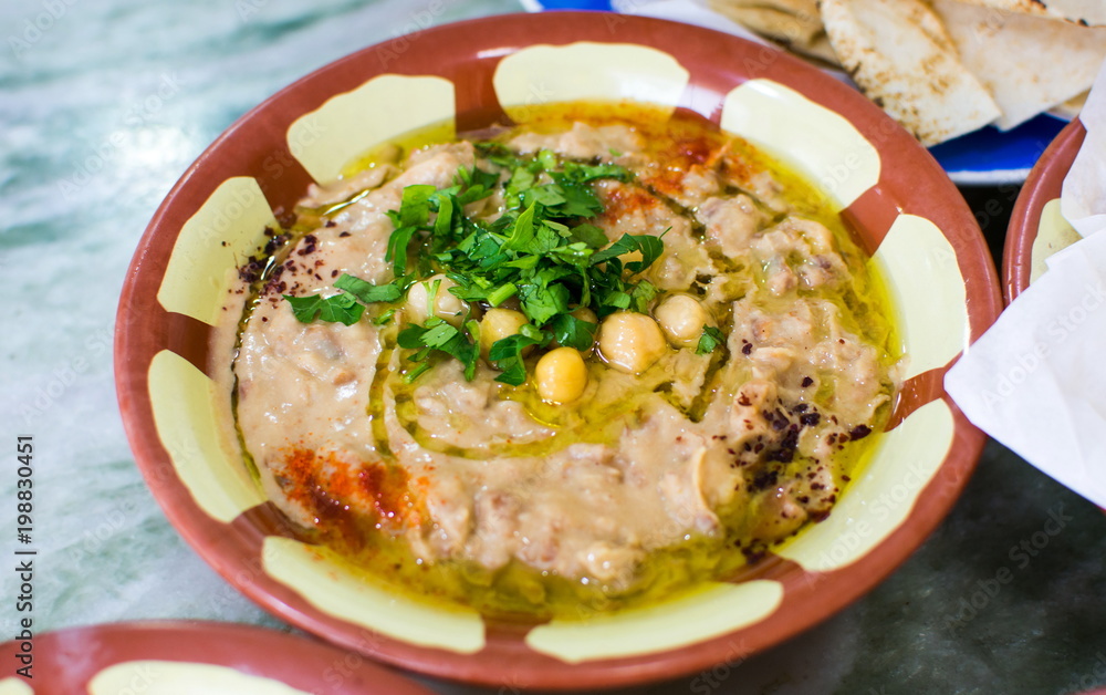 Beans and hummus on a rustic bowl