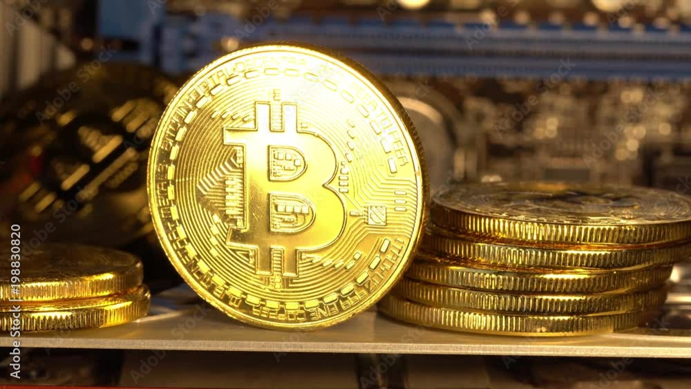 Bitcoin coin is glowed with golden light and gradually fades. Macro shot. 4K looped video.