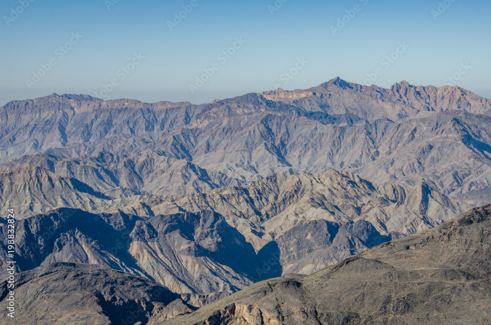 Shadows and light on mountain ridge in Oman