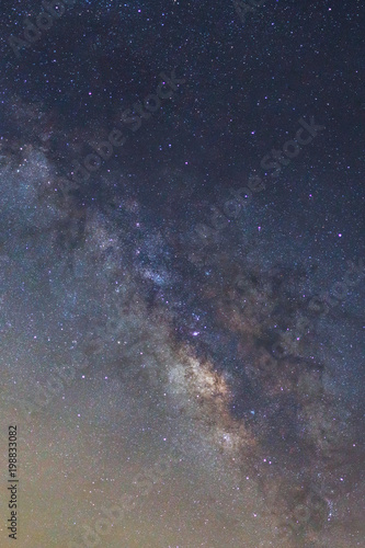 Starry night sky, Milky way galaxy with stars and space dust in the universe, Long exposure photograph, with grain.