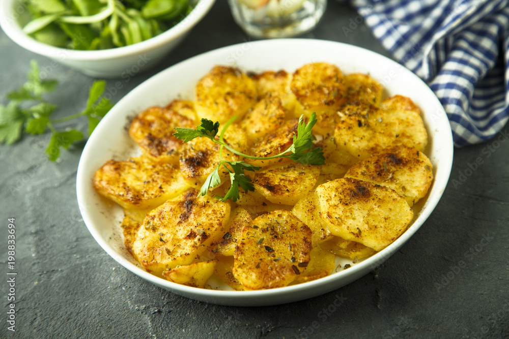 Homemade potato gratin with cheese and herbs