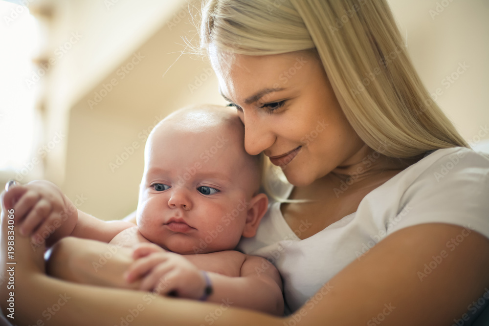 Single mother with baby boy at home. Single mother with baby boy at home.