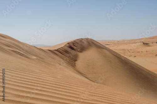 Sand dunes with wind pattern in Wahiba sands desert