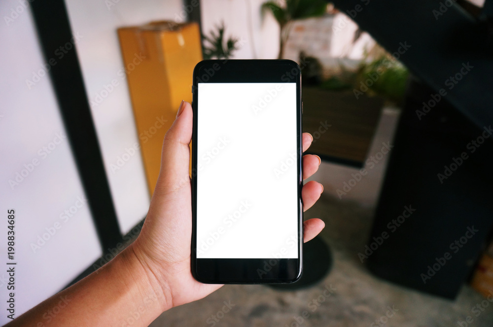 Close up of women's hands holding cell telephone blank copy space screen. smart phone with technology concept