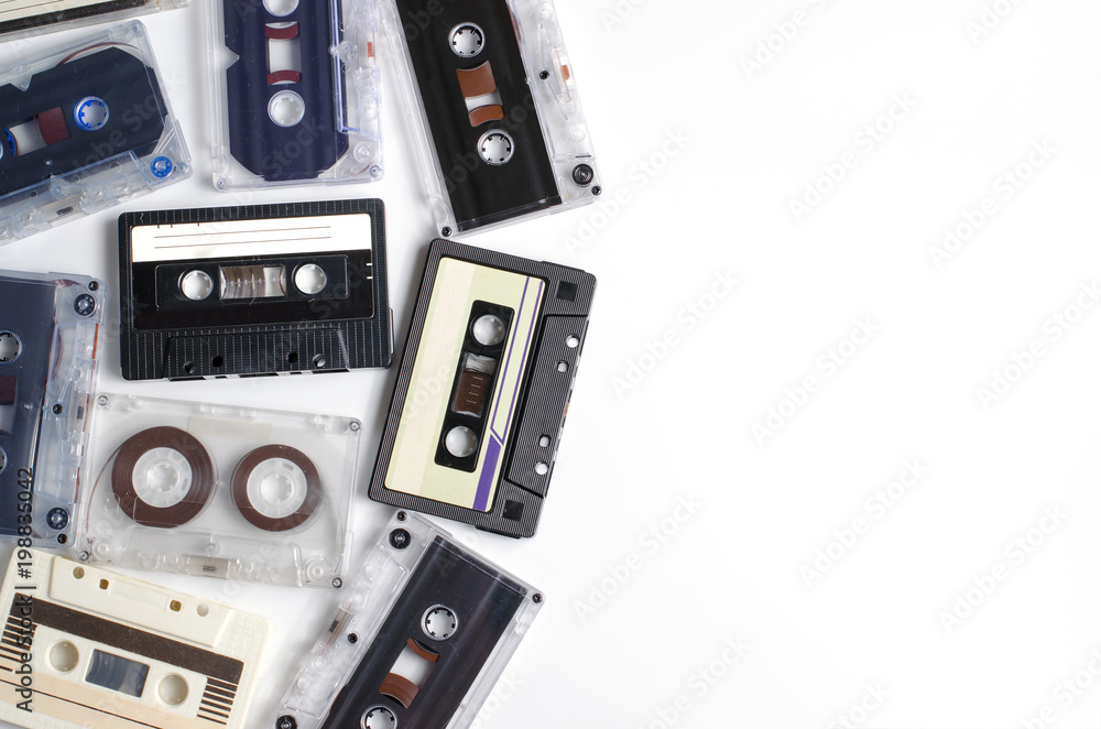 Obraz premium Old audio cassettes on white background. Flat top view