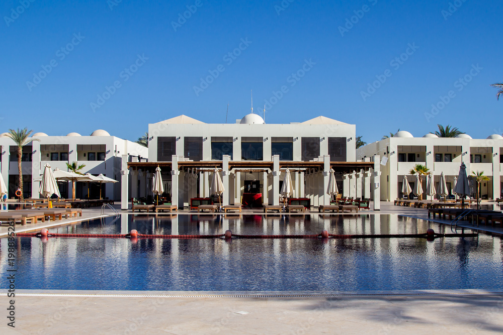 Luxurious hotel facade in Egypt with swimming pool