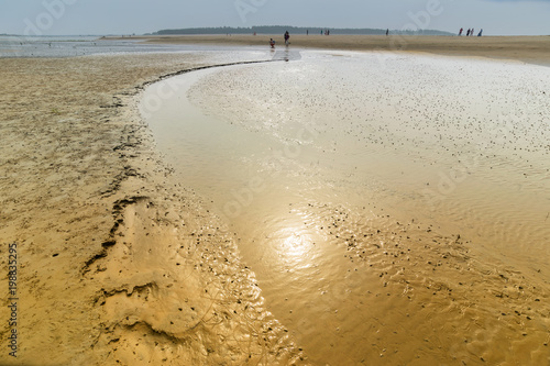 Reflection of Sun in the water of river. photo