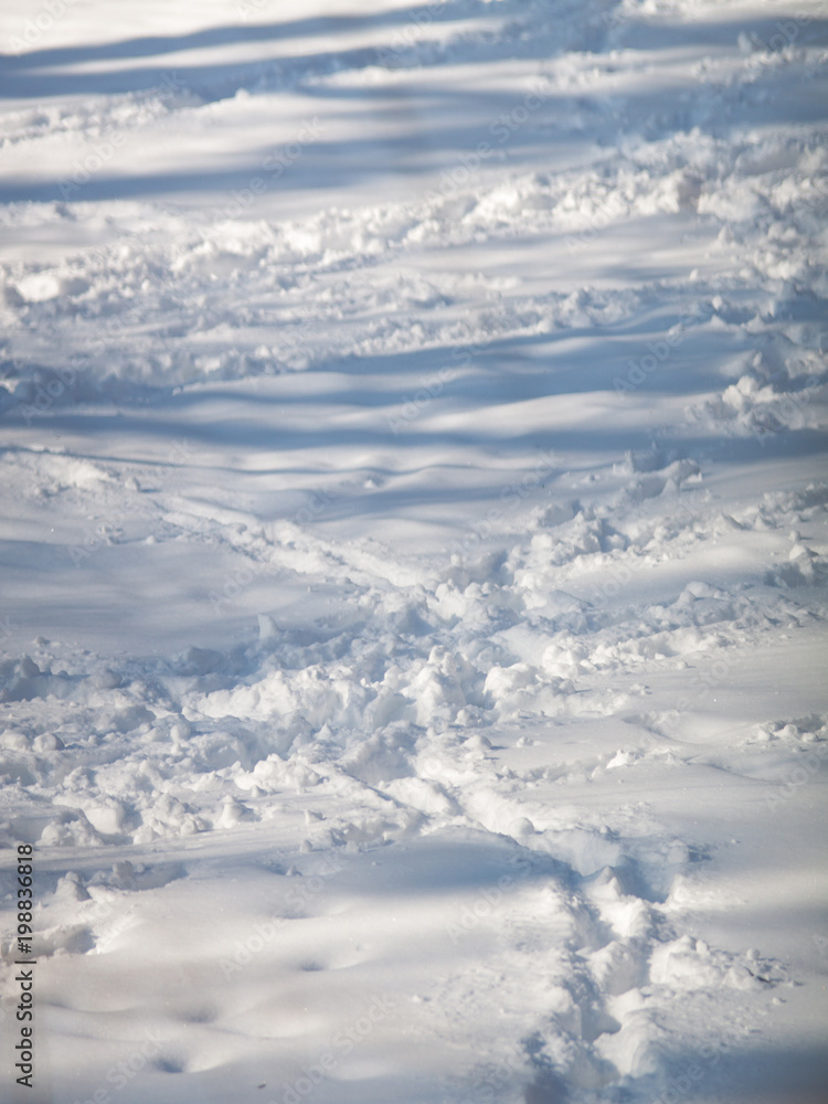 human footprints on the blue snow human footprints on the blue snow