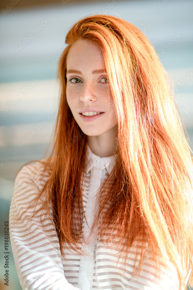 closeup portrait of cheerful woman with green eyes and red hair in white  striped blouse looking at the camera. redolish pigment. amazing red-haired  model. beautiful hair. fashion woman Stock Photo | Adobe