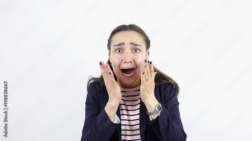 Portrait of a young beautiful woman. Frightened gesture Portrait of a young beautiful woman. Frightened gesture