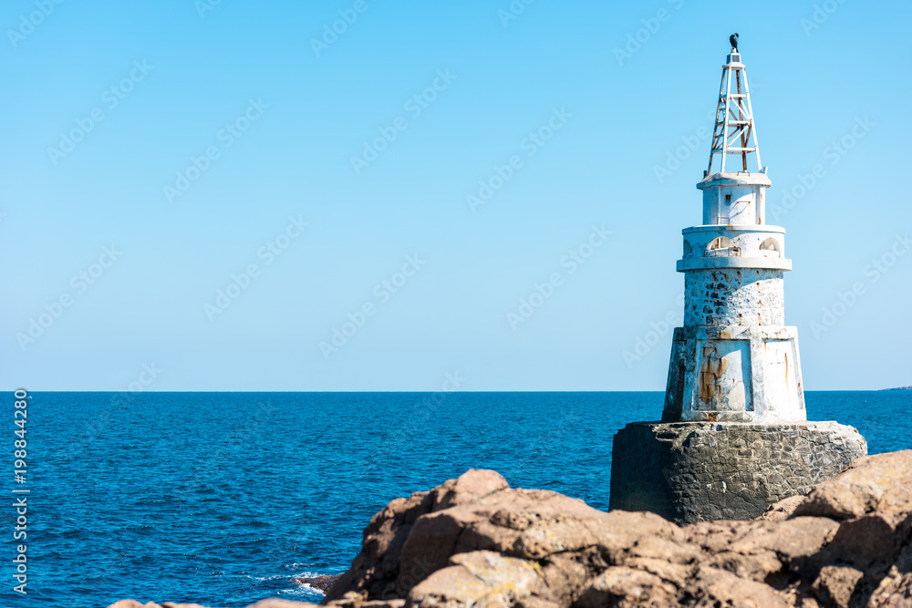 A lighthouse on the rocks. Black Sea. Ahtopol. Bulgaria.