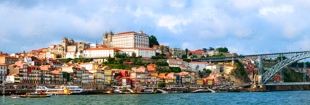Panoramic view of colorful old houses of Porto, Portugal with Luis I Bridge