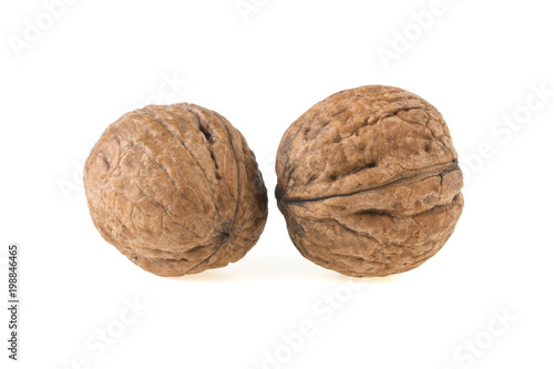 two walnuts on a white background