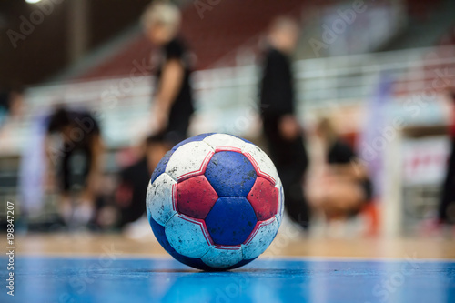 Valokuvatapetti Handball ball on court' s floor