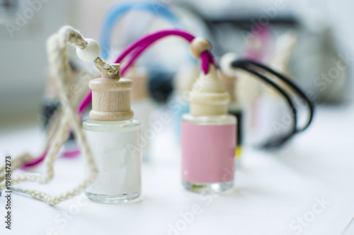 multicolored vials with wooden caps and strings photo