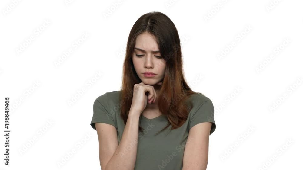 Portrait of hesitating woman in casual t-shirt thinking or remembering in doubt, isolated over white background closeup. Concept of emotions Portrait of hesitating woman in casual t-shirt thinking or remembering in doubt, isolated over white background closeup. Concept of emotions