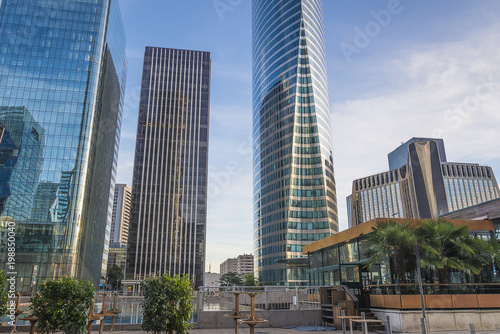 Modern cityscape with beautiful skycrapers on sunny day © stsvirkun