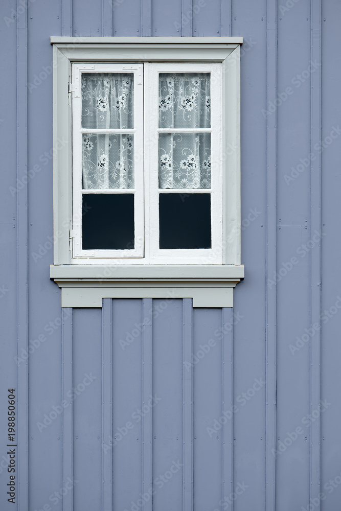 Window of an old traditional wooden house.