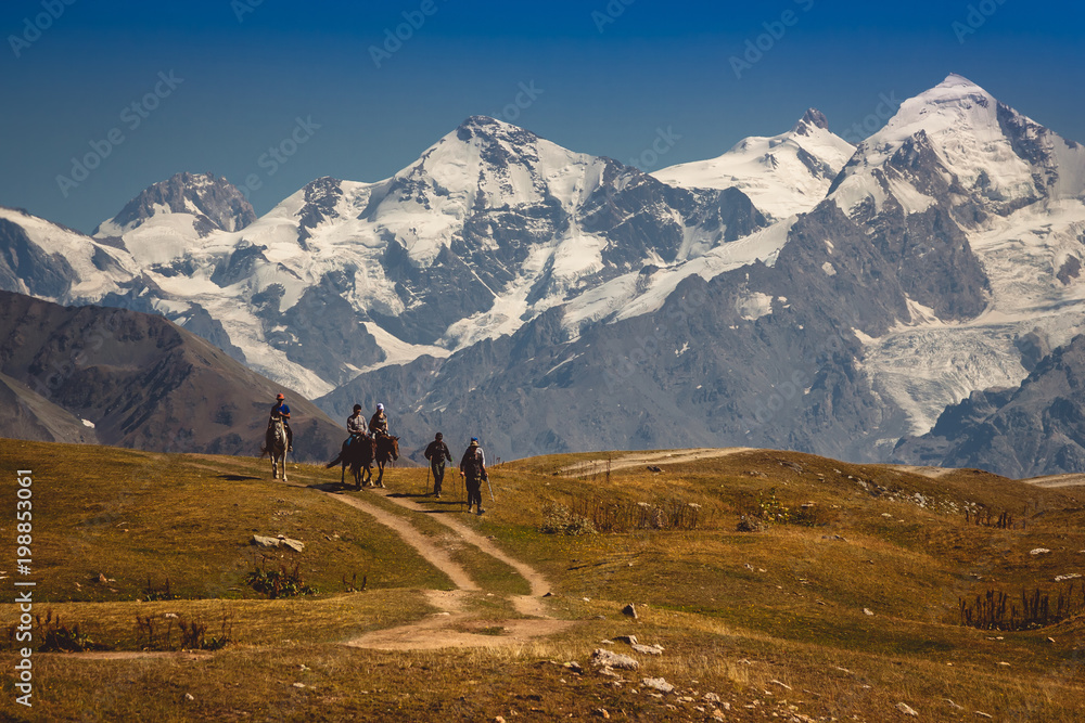 A group of tourists in the Caucasus in Georgia. A beautiful mountain landscape. Svaneti. Nature and mountains.