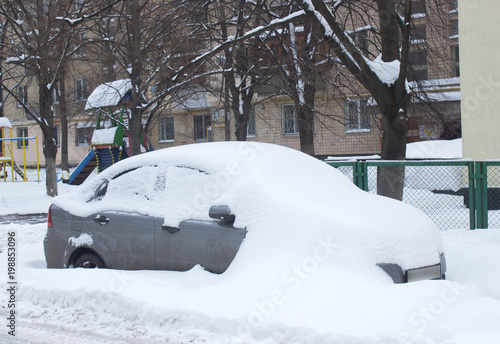 Parked car under snow