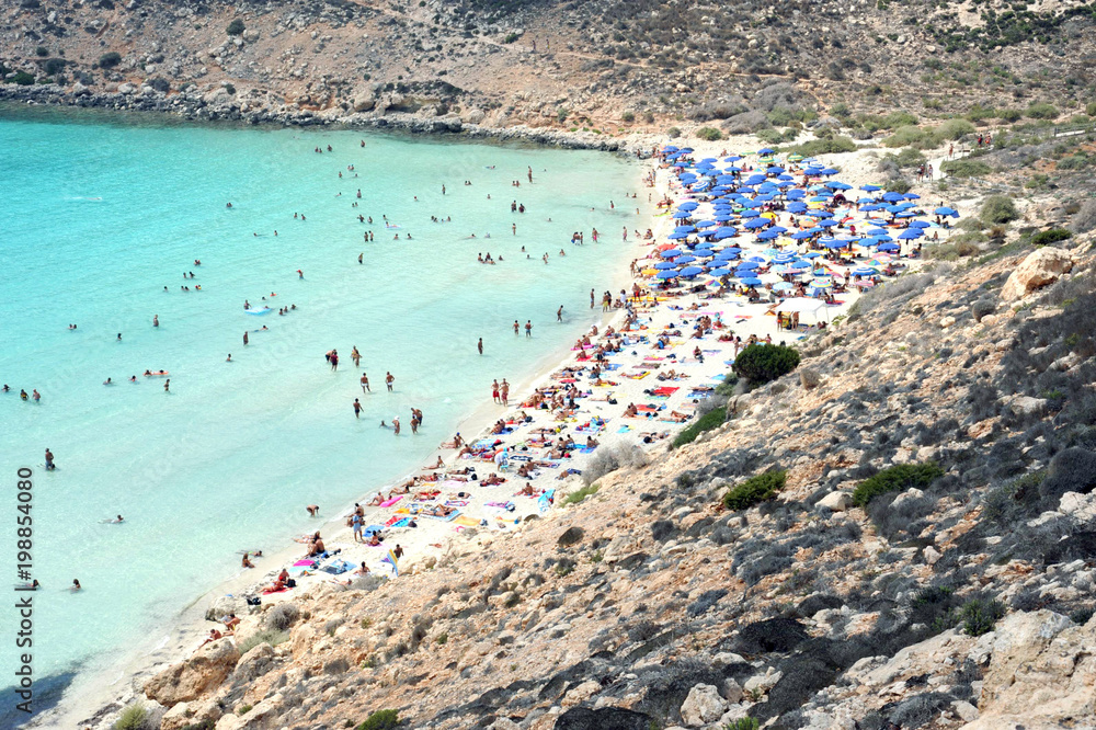 Fototapeta premium Lampedusa, Italy - August/25/2010 : tourists in rabbit island beach