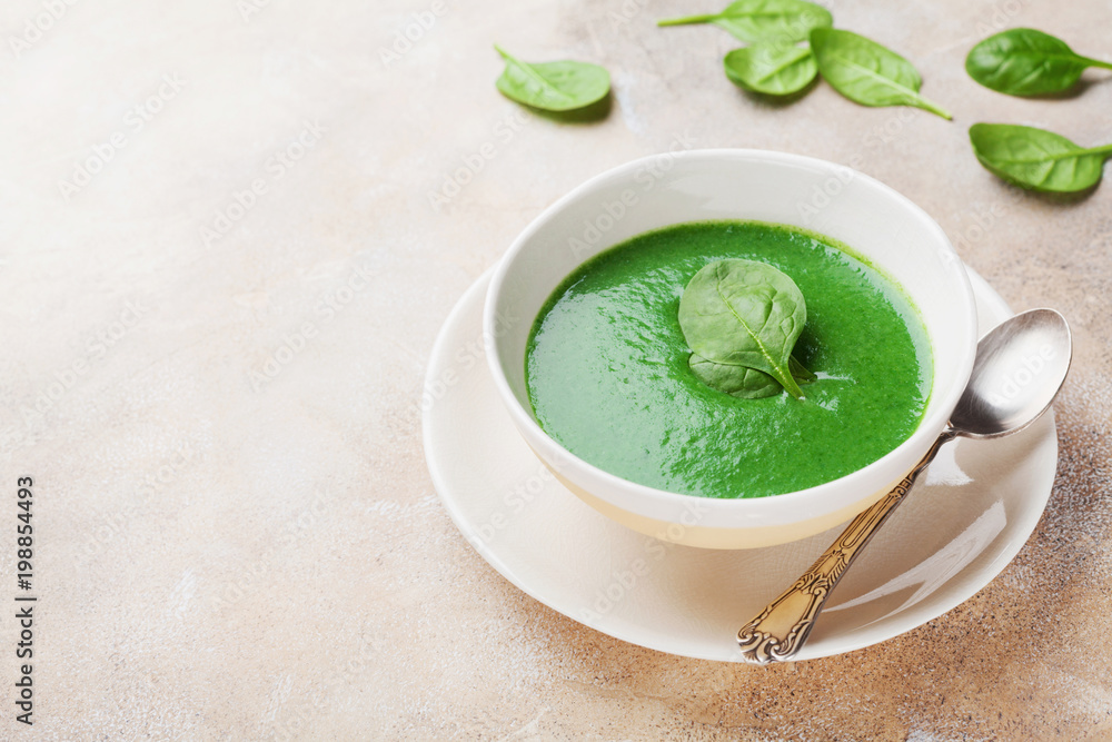 Creamy spinach soup in bowl. Healthy and diet food. Creamy spinach soup in bowl. Healthy and diet food.