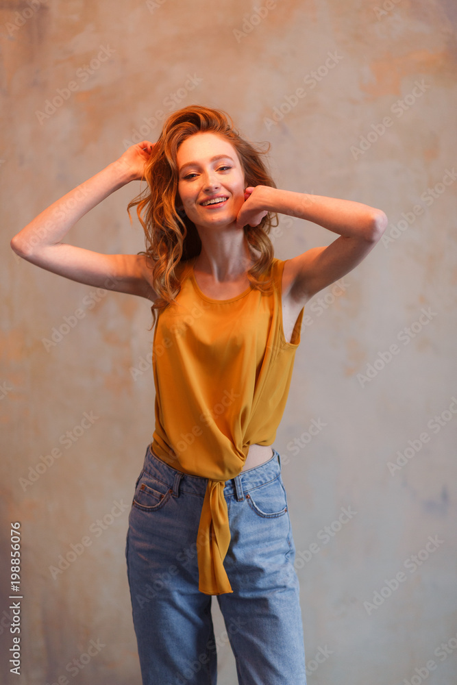 Portrait of beautiful young woman touching her hair. Redhair long hairstyle Portrait of beautiful young woman touching her hair. Redhair long hairstyle