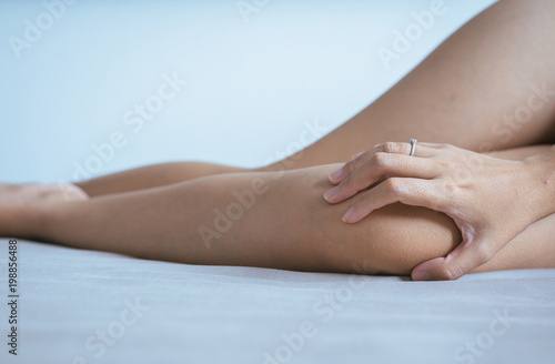Fototapeta Naklejka Na Ścianę i Meble -  Woman having a knee pain,Female feeling exhausted and painful