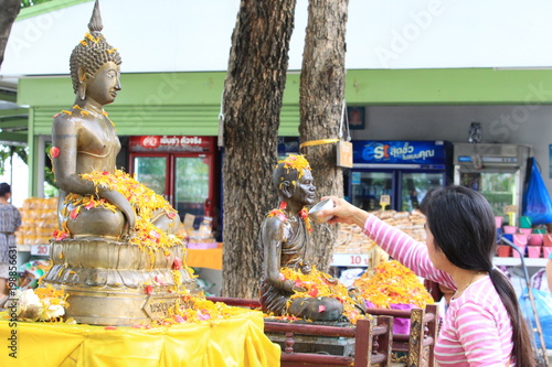 Thai girls and laos girls splashing water during Songkran festival,Water blessing ceremony of adults,Buddha statue water ceremony in songkran festival,Thailand traditional. April 1, 2018
