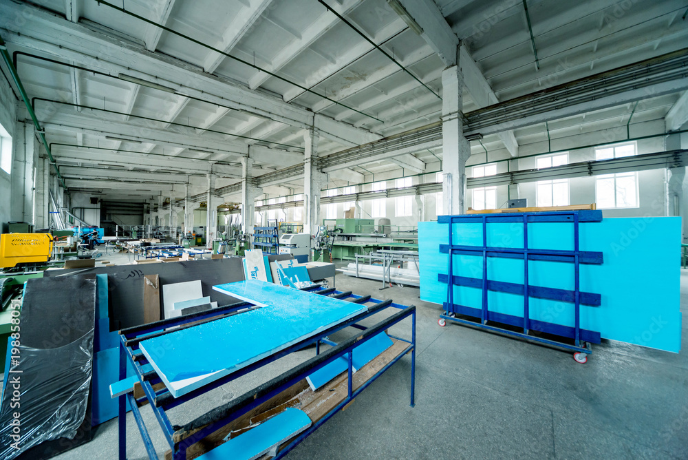 Fototapeta premium Factory for aluminum and PVC windows and doors production. Details industrial equipment.