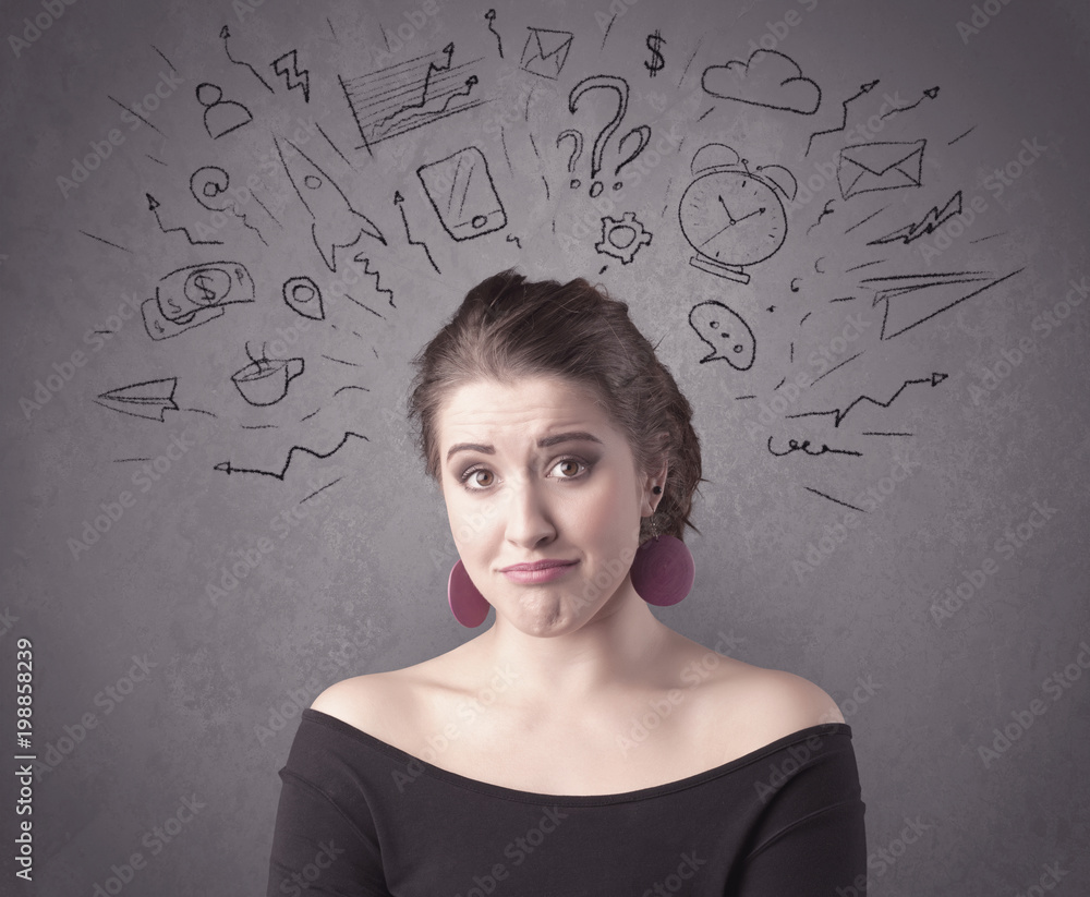 A dark brown haired pretty teenage girl with thoughts in her head illustrated by question mark, rocket, money, coffee, clock, email, social life icons drawn on the background wall concept. A dark brown haired pretty teenage girl with thoughts in her head illustrated by question mark, rocket, money, coffee, clock, email, social life icons drawn on the background wall concept.