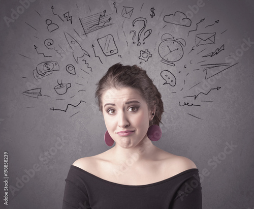 A dark brown haired pretty teenage girl with thoughts in her head illustrated by question mark, rocket, money, coffee, clock, email, social life icons drawn on the background wall concept.