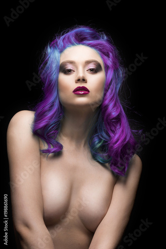 Sensual portain of beautiful dyed violet multicolour hair topless covering her big breast girl isolated on black background photo