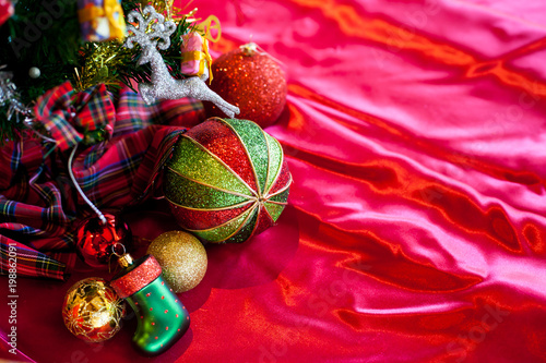 Christmas decoration collection on red fabric.