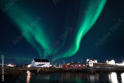 Northern light shining in the sky with village foreground in Lofoten,Norway
